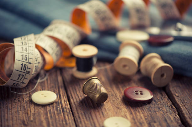 istock Sewing accessories on wooden 673632852