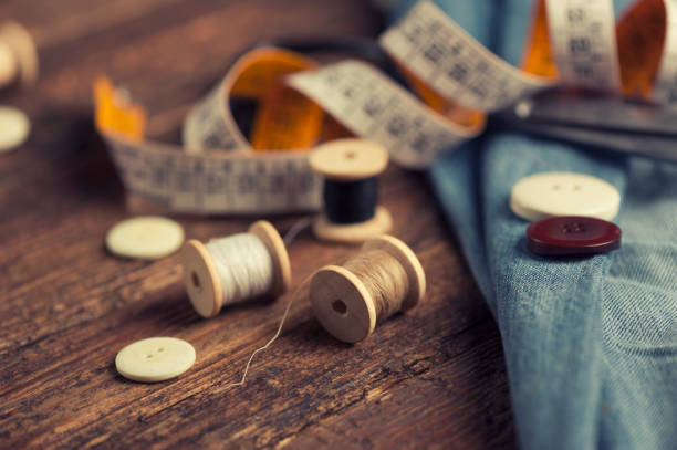 istock Sewing accessories on wooden 673634370