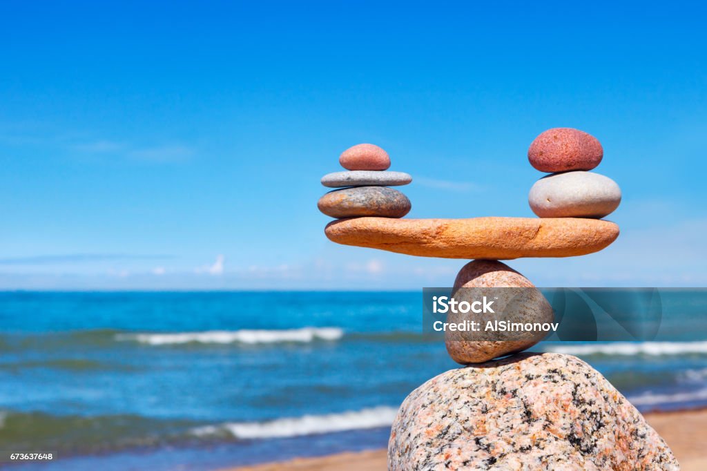 Concept of harmony and balance. Balance stones against the sea. Concept of harmony and balance. Balance stones against the sea. Rock zen in the form of scales Balance Stock Photo