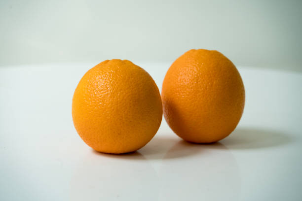 istock The organic orange isolated on white background 673638104