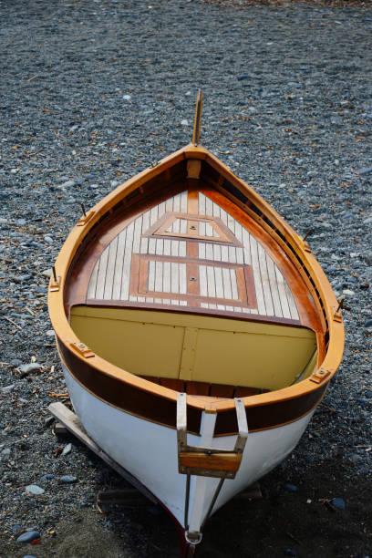 istock fishing wooden boat moored on the beach 673638690