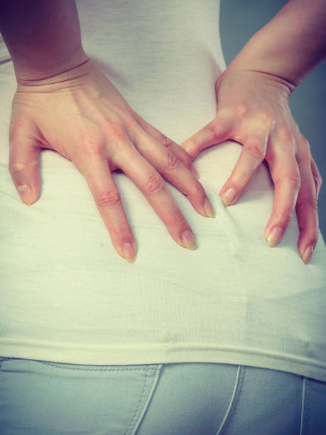istock Woman suffering from back pain 673643540