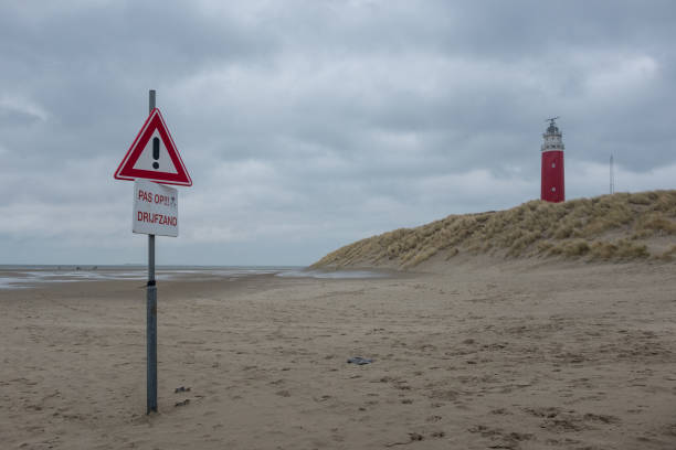 istock Lighthouse on the beach of Texel, the Netherlands 673646916