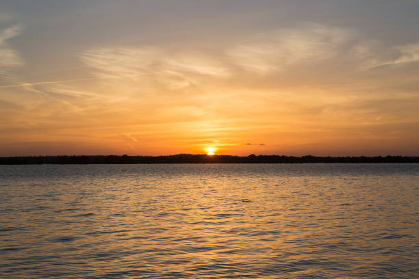 istock Sunset in lake at Martin Dies state park, Texas 673652292