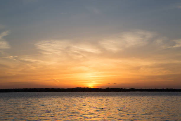 istock Sunset in lake at Martin Dies state park, Texas 673652298