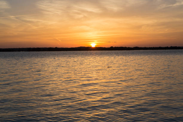 istock Sunset in lake at Martin Dies state park, Texas 673652306