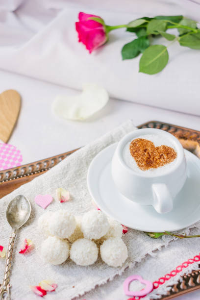 istock Coffee and candy in bed breakfast in hotel room. 673658014