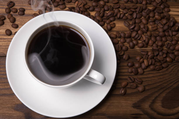 istock A cup of coffee on a wooden table 673673412