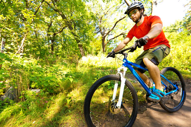 istock Mountain Biking in Wooded Biking Trail 673674936