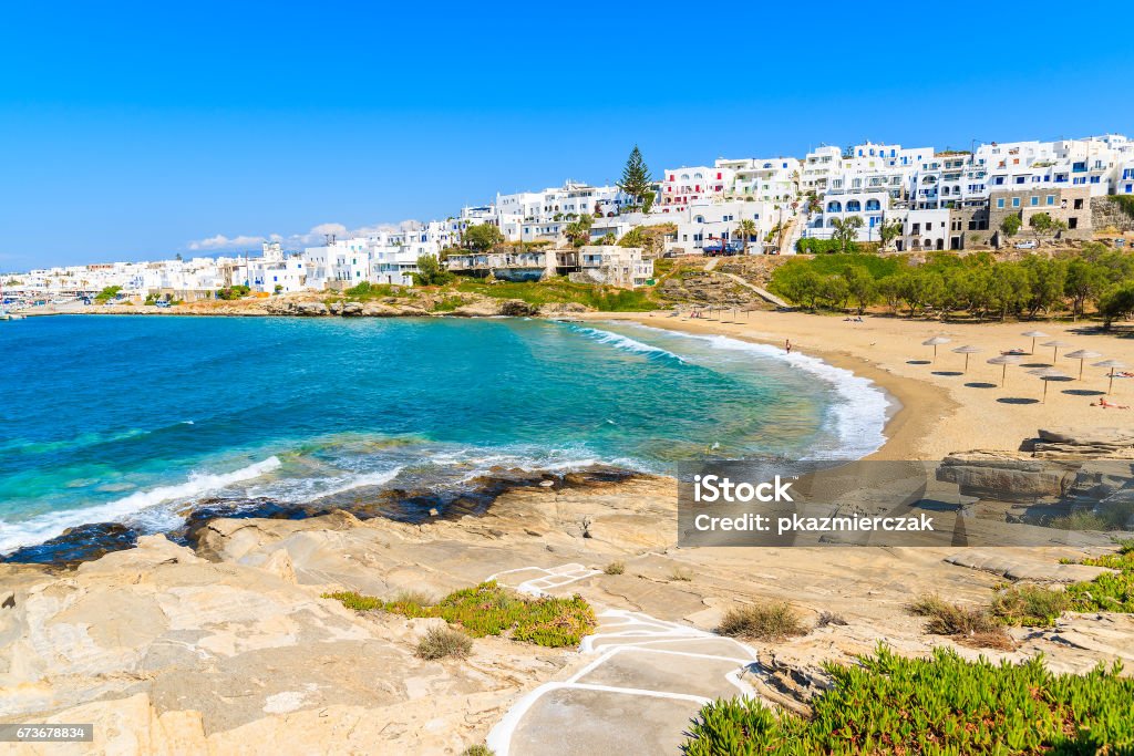 Path to Piperi beach in Naoussa village, Paros island, Cyclades, Greece The island of Paros is one of the most famous Greek islands of the Aegean Sea and it belongs to the Cyclades islands archipelago. Beach Stock Photo