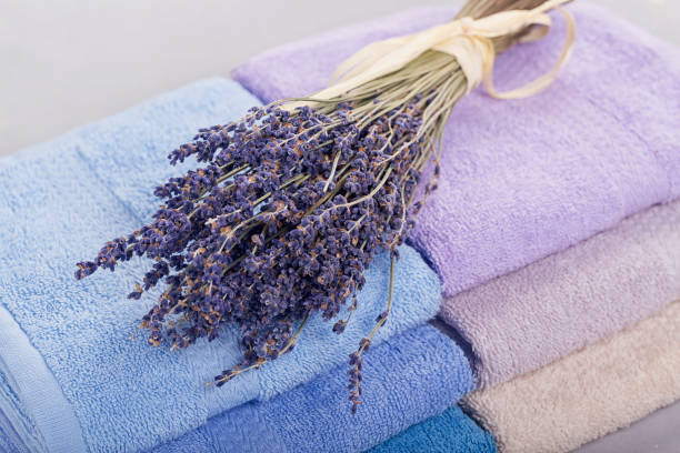 istock Stack of colorful bath towels on light background. 673684420