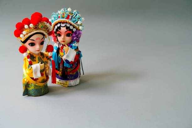 istock Traditional married Chinese dolls isolate on gray background - focusing on groom 673688266