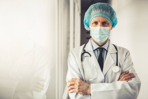 istock Handsome mature doctor 673692362