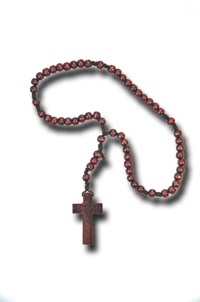 istock A wood homemade rosary with white background 673694696