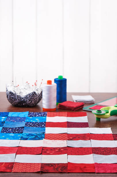 preparing to sewing of pieces of fabrics that look like a flag of usa - patch textile stack heap imagens e fotografias de stock