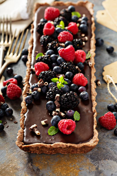 istock Chocolate ganache tart with fresh berries 673710240