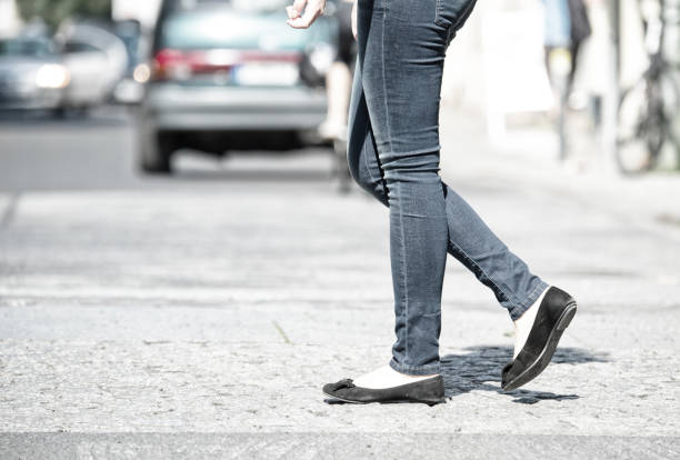 istock Woman crossing street 673713078