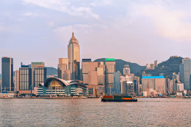 istock Container ship at Victoria Harbor in Hong Kong at sunset 673713268