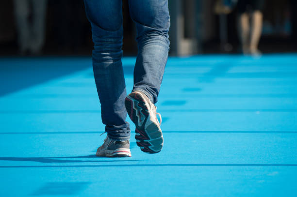 istock Man crossing blue street 673713404
