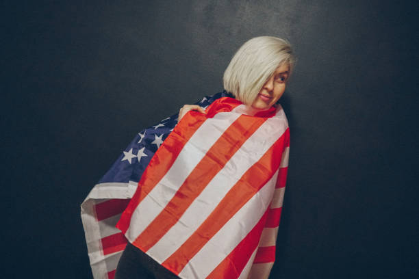 istock Blonde girl with USA flag 673716228