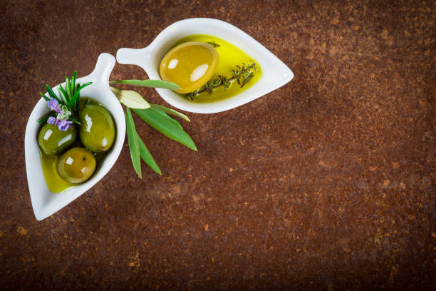 istock Extra virgin olive oil and green olives 673719408