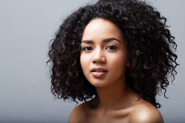 istock Beautiful black haired woman looking at camera, studio shot 673719426