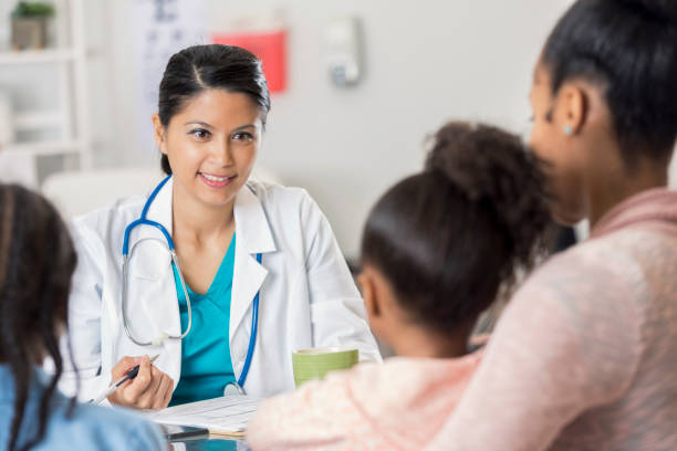 istock Pediatrician discusses patient diagnosis 673719492