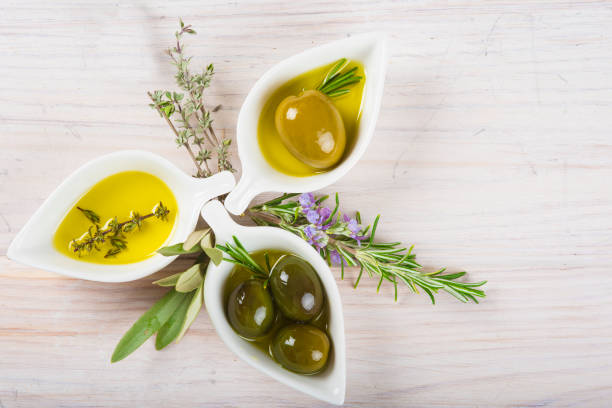 istock Extra virgin olive oil and green olives 673719956