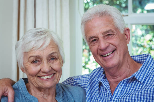 istock Close-up happy senior couple with arm around 673723110