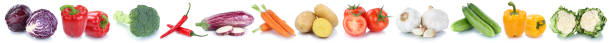 istock Vegetables carrots tomatoes fresh bell pepper isolated in a row 673729682