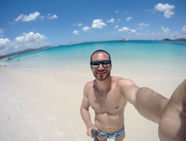 istock Man taking a selfie in Whitsunday, Australia 673730062