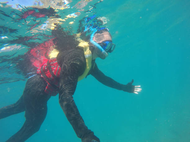 istock Scuba Diver Underwater taking a selfie in Whitsundays, Australia 673730172