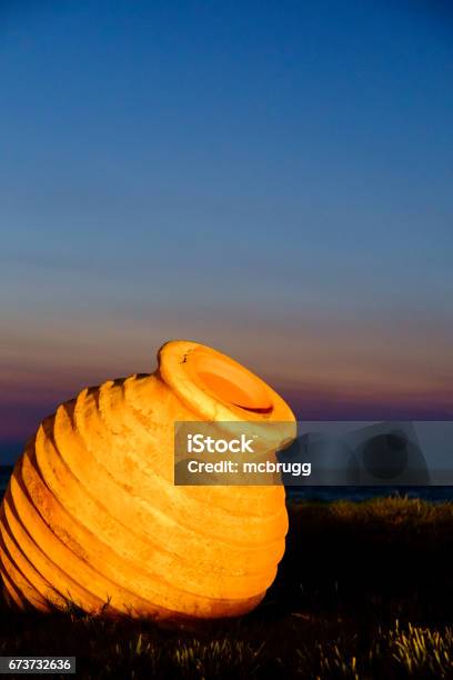 Classical Greek Amphora In The Sunset Stock Photo - Download Image Now - Beach, Clay, Amphora