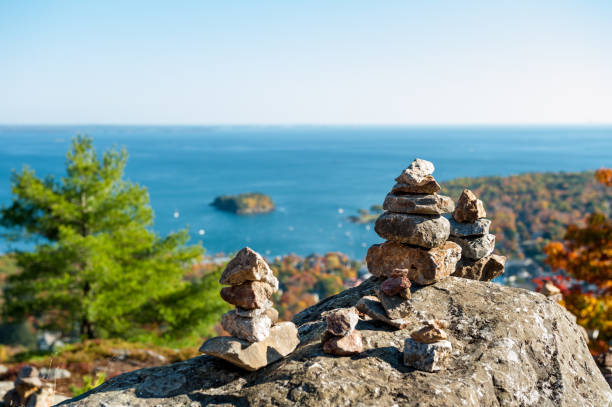 Small cairns on the summit of Mount Battie, overlooking Camden, Maine harbor. stock photo