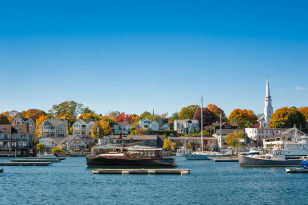 Camden, Maine harbor in autumn with boats moored in the harbor stock photo