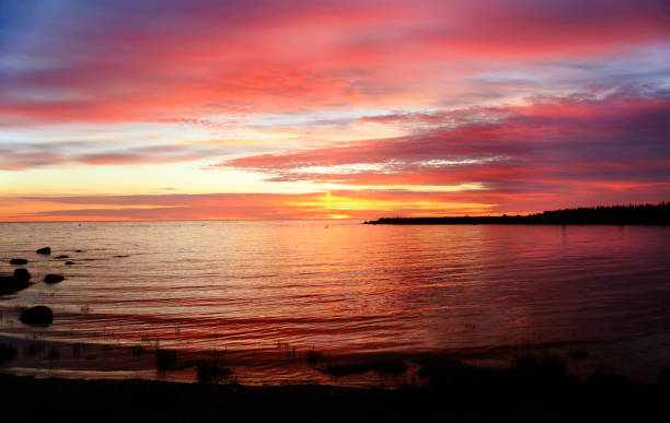 istock Bright pink and yellow sunset over the sea 673738290