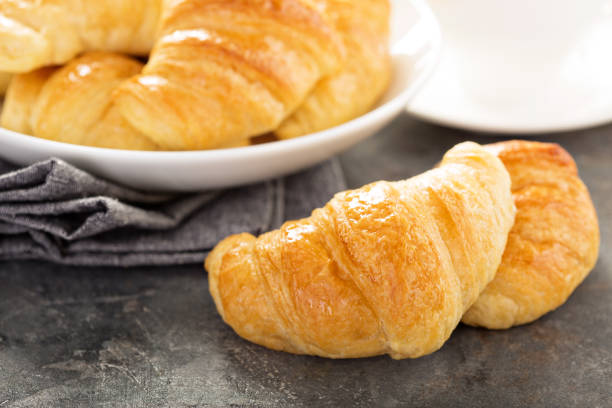 istock Freshly baked croissants in a bowl 673739178