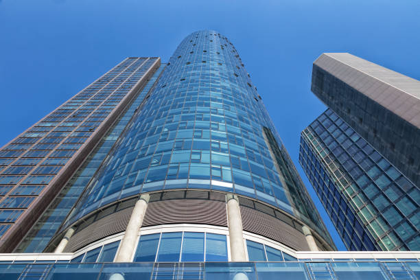 Modern corporate buildings, office buildings in financial district, low angle view with blue sky, Frankfurt, Germany.