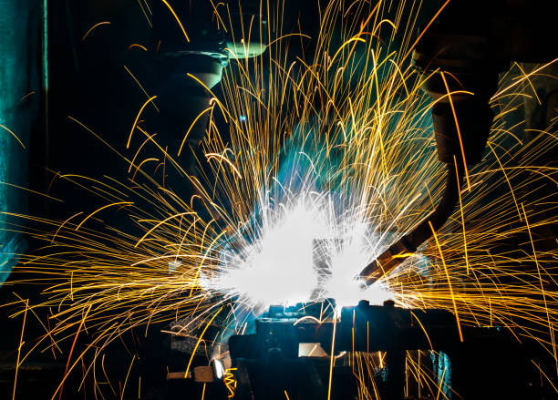 istock Welding robots movement in a car factory 673742662