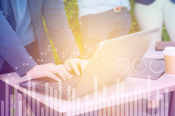 istock Business economic and technology working concept. Woman hand using notebook double exposure graph money stock trading finance concept. 673744990