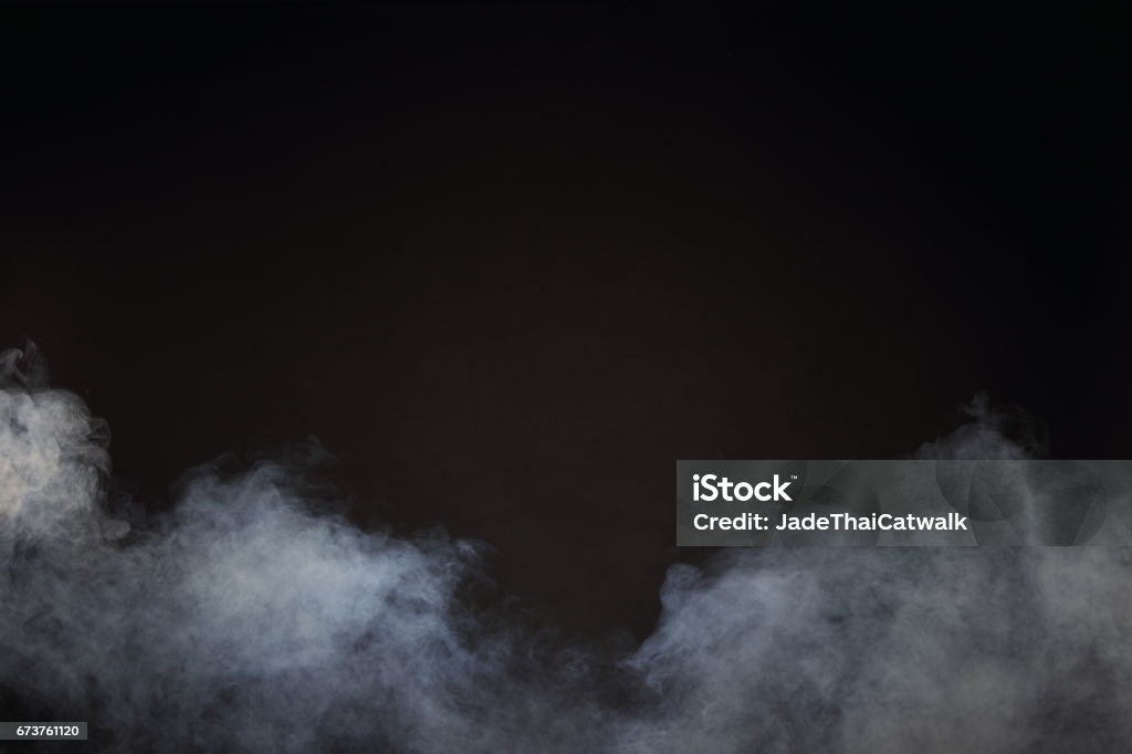 White Smoke and Fog on Black Background, Abstract Smoke Clouds Dense Fluffy Puffs of White Smoke and Fog on Black Background, Abstract Smoke Clouds, All Movement Blurred, intention out of focus, and high low exposure contrast, copy space for text logo Fog Stock Photo