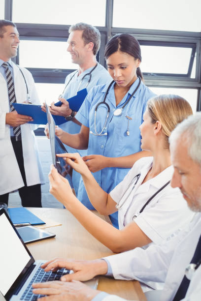 istock Medical team interacting in conference room 673761598