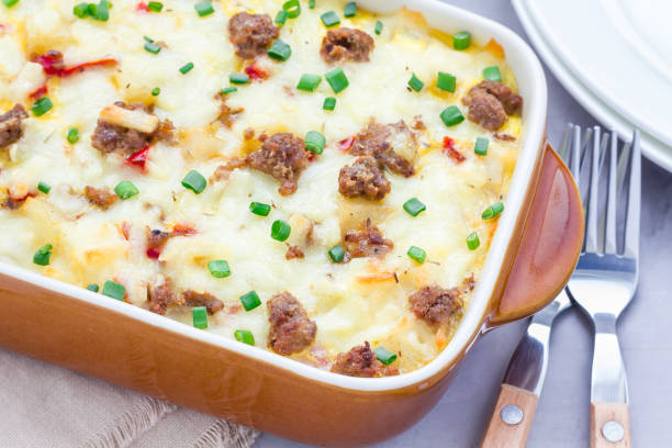 istock Egg casserole with potatoes, sausage and pepper, in baking dish, horizontal 673765928
