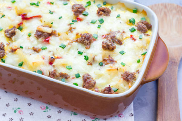 istock Egg casserole with potatoes, sausage and pepper, in baking dish, horizontal 673765948