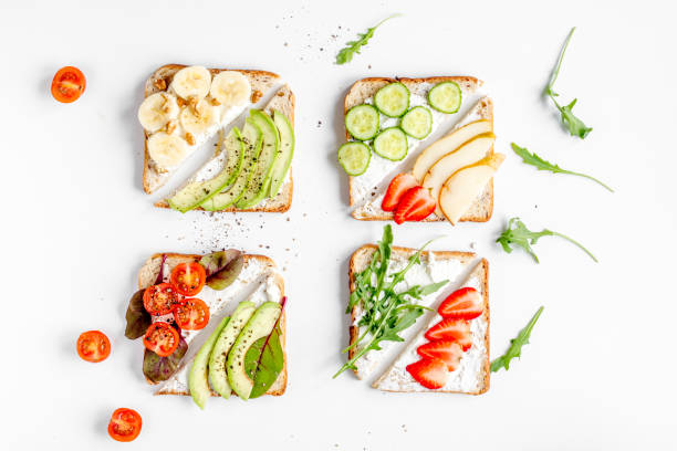 istock lunch with triangle sandwiches on white table background top view 673768278