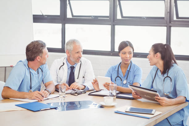 istock Medical team interacting in conference room 673768366