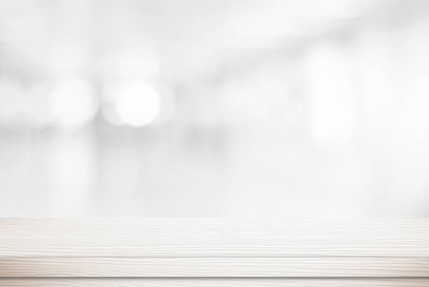 istock Empty white wood table over blur bokeh, vintage, background, template, product display montage 673768898
