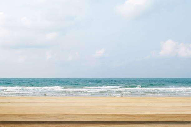 istock Empty table over blur sea background, product display montage 673771058