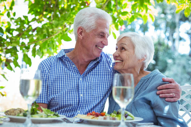 istock Cheerful retired couple with arm around 673771682