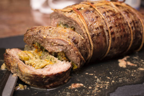 istock Rolled and baked flank steak on a cutting board 673774442